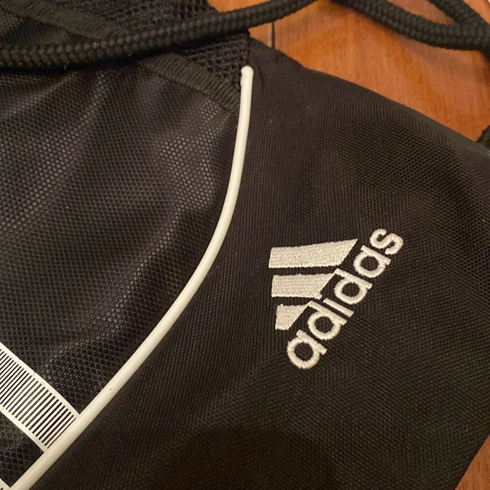 Adidas  black w/ 3 gray stripe polyester Drawstring Backpack front zip pocket
